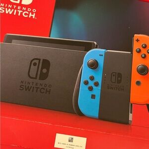 Nintendo Switch Console with Blue and Orange Joy-Con